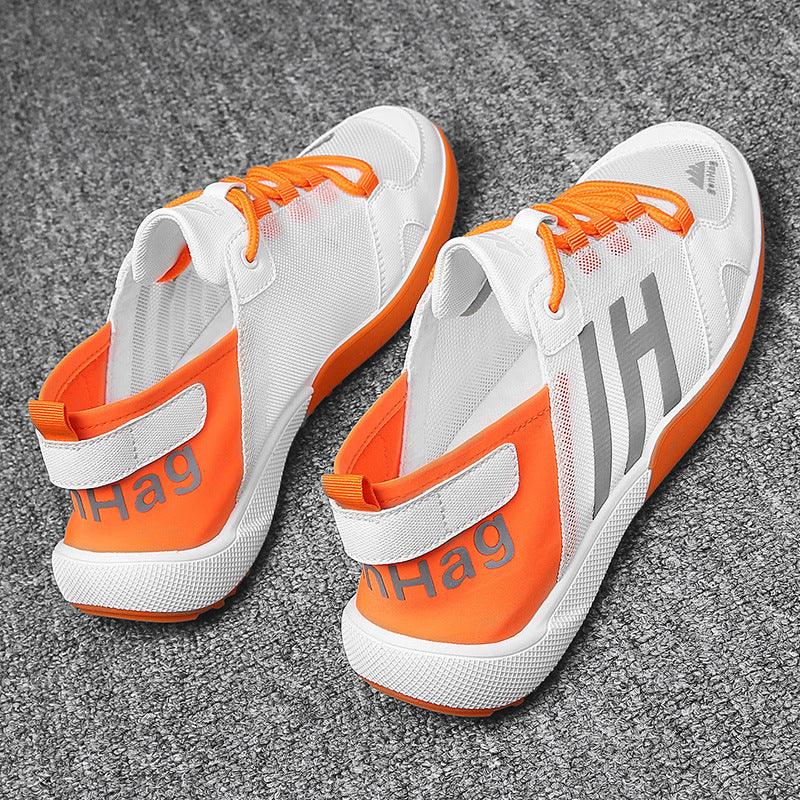 Stevvex men's sneakers with white mesh upper, orange laces and heel accents on Tampa Home & Garden Store