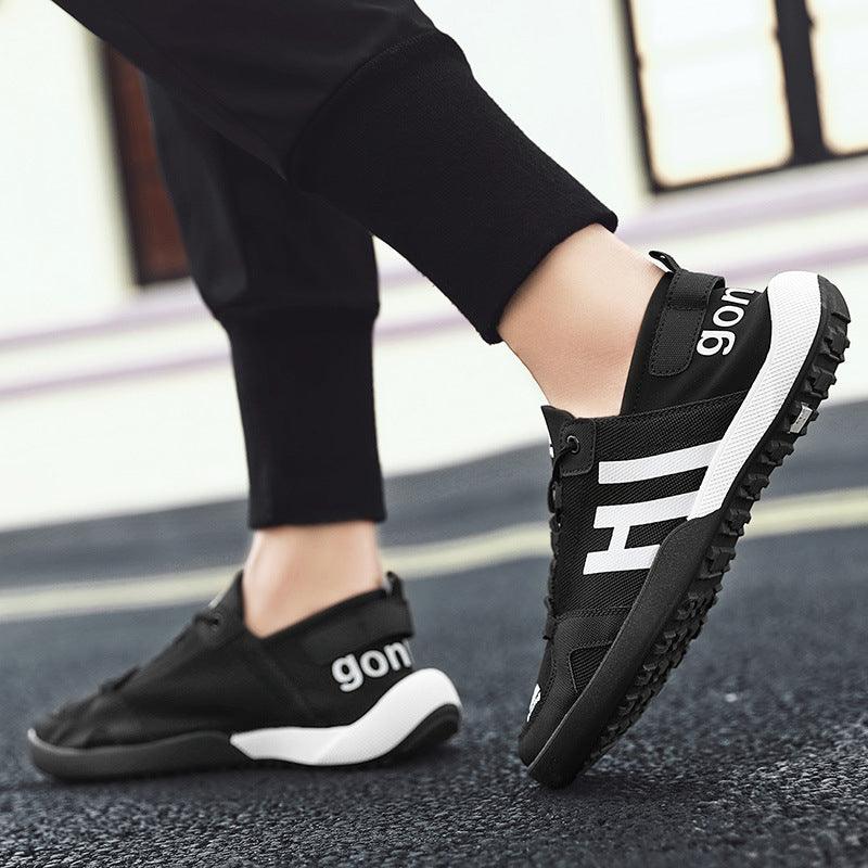 Stevvex black mesh slip-on sneakers with white midsole and bold side lettering on Tampa Home & Garden Store