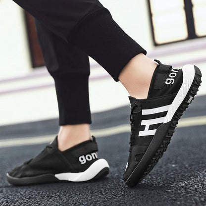 Stevvex black mesh slip-on sneakers with white midsole and bold side lettering on Tampa Home & Garden Store