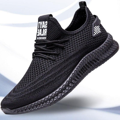 Stevvex men's black mesh sneakers with breathable knit upper and geometric-pattern sole on Tampa Home & Garden Store