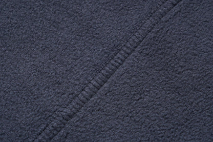 Stevvex navy fleece jacket fabric close-up with textured weave and diagonal seam on Tampa Home & Garden Store