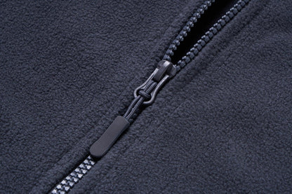 Fleece jacket close-up in dark charcoal with zipper and cord pull windproof fabric on Tampa Home & Garden Store