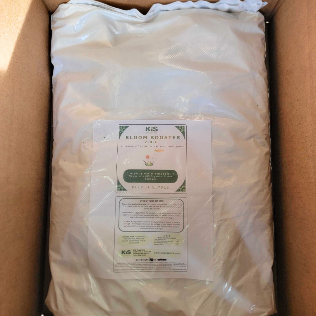 KiS Organics Bloom Booster 2-8-6 fertilizer bag in white packaging inside a cardboard box on Tampa Home & Garden Store