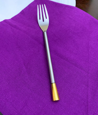Vibhsa flatware fork stainless steel with gold-tone handle on purple napkin on Tampa Home & Garden Store