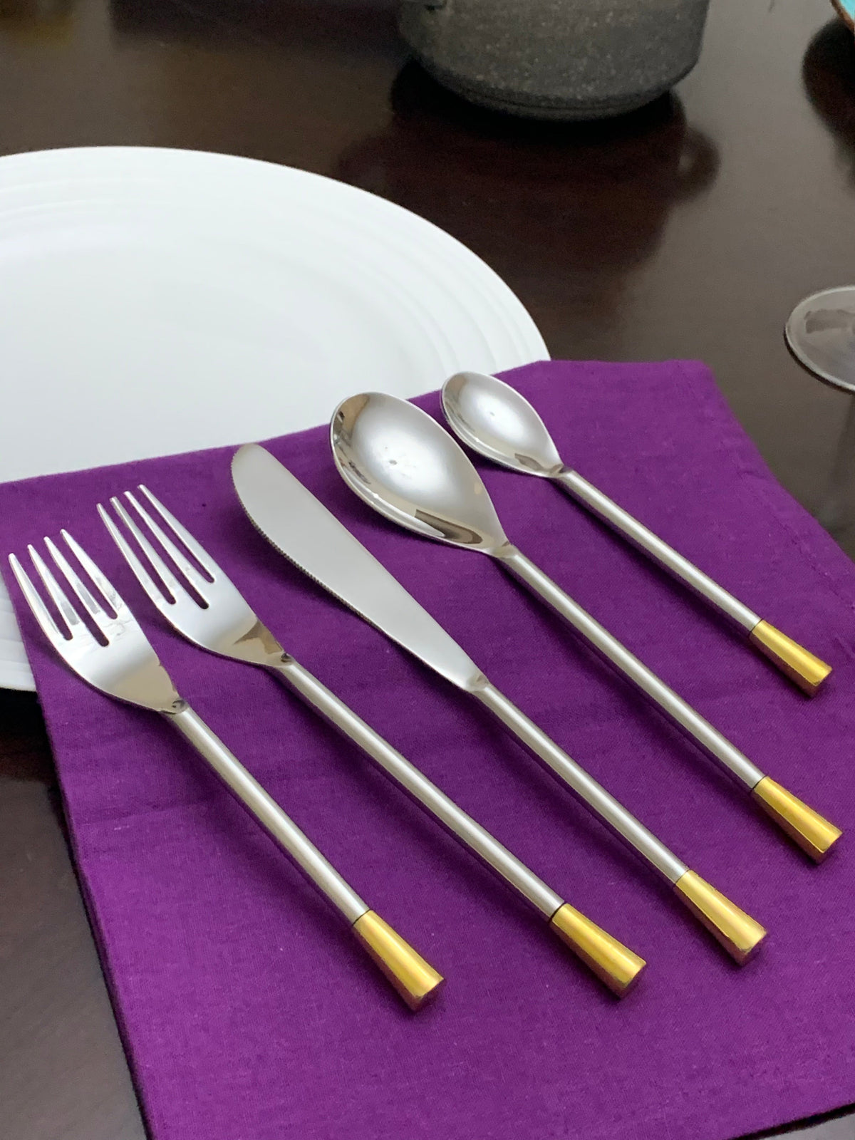Vibhsa 20-piece flatware set for 4, stainless steel with gold-tipped handles on napkin on Tampa Home & Garden Store