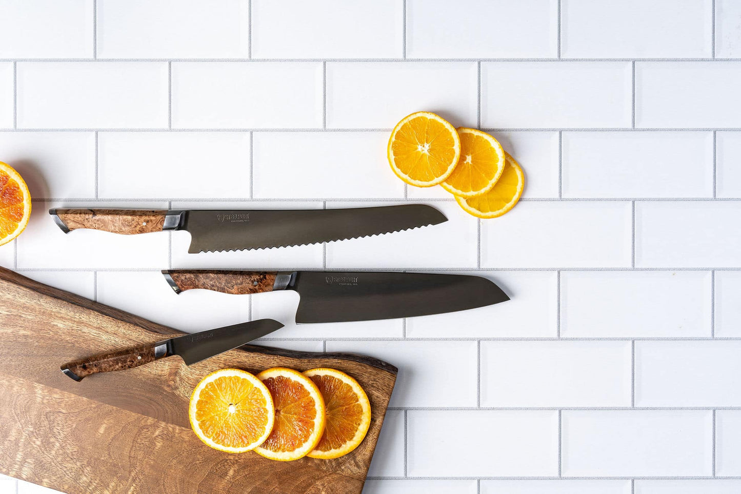 3-piece STEELPORT Knife Co. kitchen knife set with wood handles on cutting board on Tampa Home & Garden Store