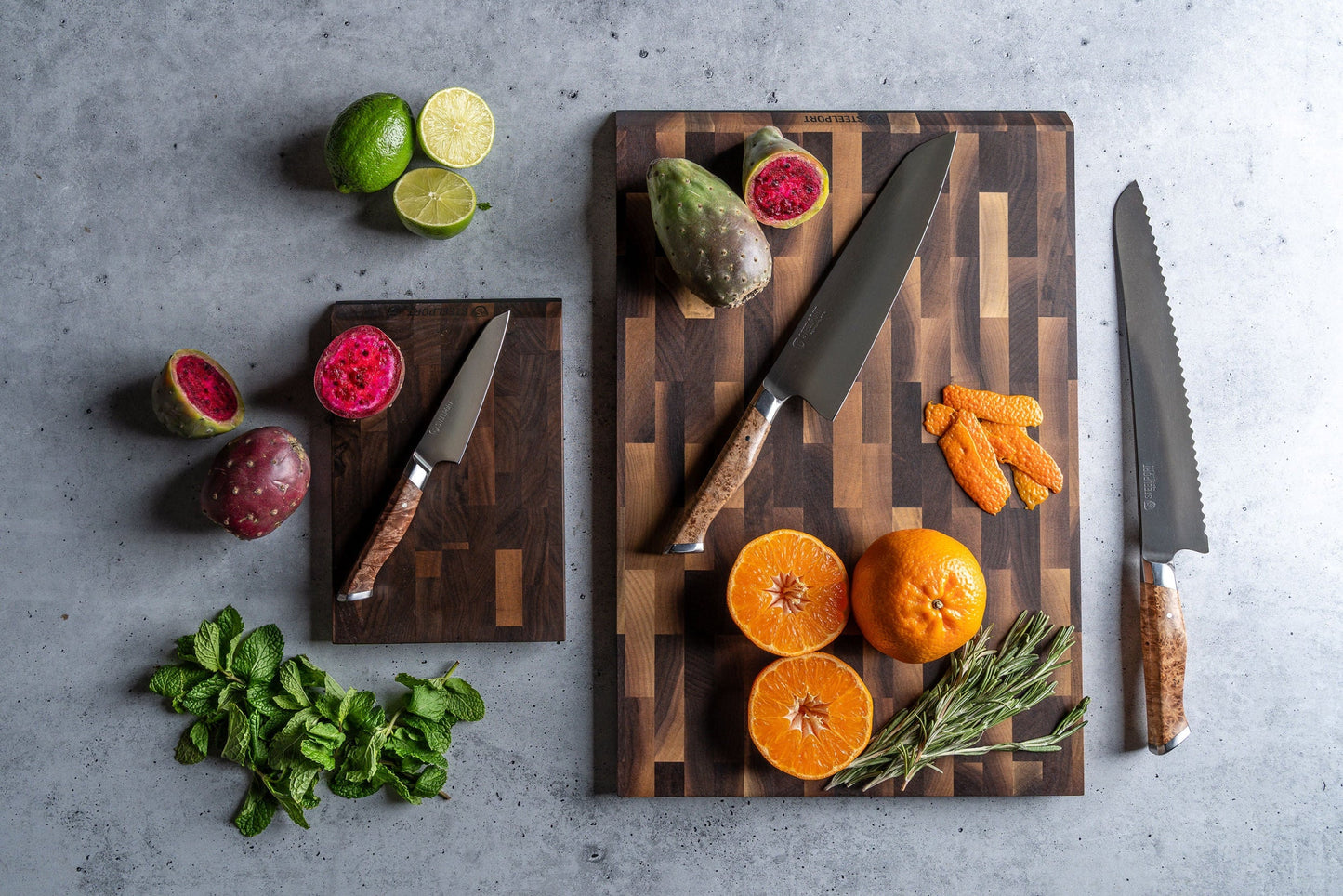 Signature Knife & Board Set by STEELPORT on two dark wooden boards with kitchen knives on Tampa Home & Garden Store