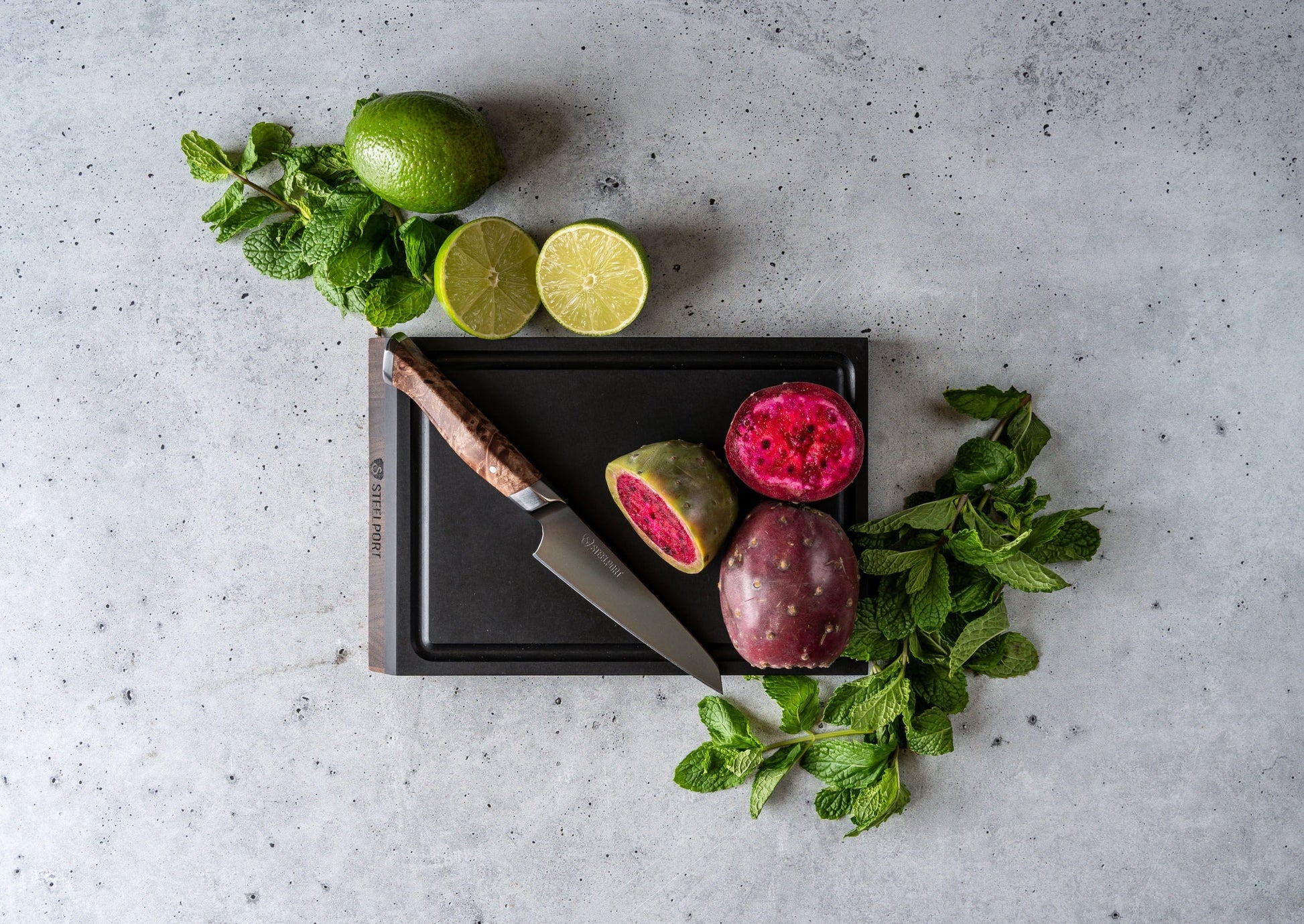 Bar Set knife on black cutting board with lime halves, mint and STEELPORT Knife Co. on Tampa Home & Garden Store