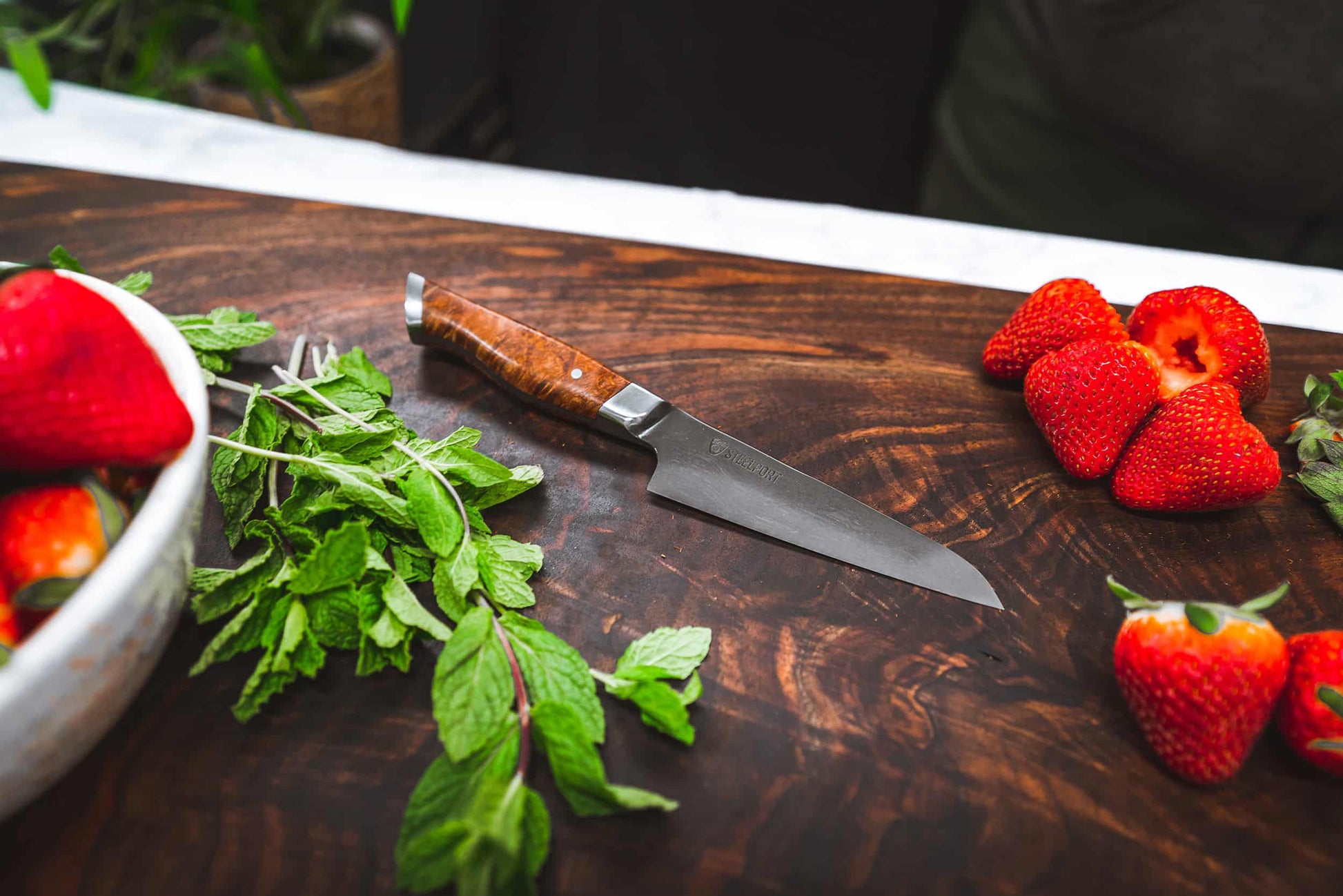 4-inch paring knife STEELPORT Knife Co. wood handle on board beside mint and strawberries on Tampa Home & Garden Store