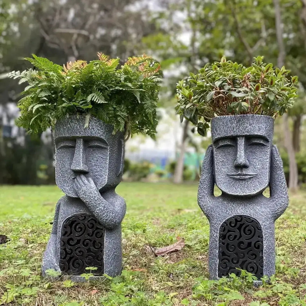 Stone gray Easter Island Moai planter statues (2) with greenery by Decorbites for garden decor on Tampa Home & Garden Store