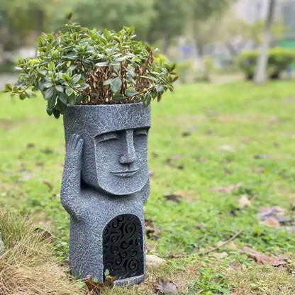Stone gray moai planter statue with textured finish and green plant top Decorbites on Tampa Home & Garden Store