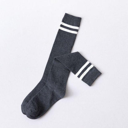 Striped long thigh-high stockings pair in dark gray knit with white bands on Tampa Home & Garden Store
