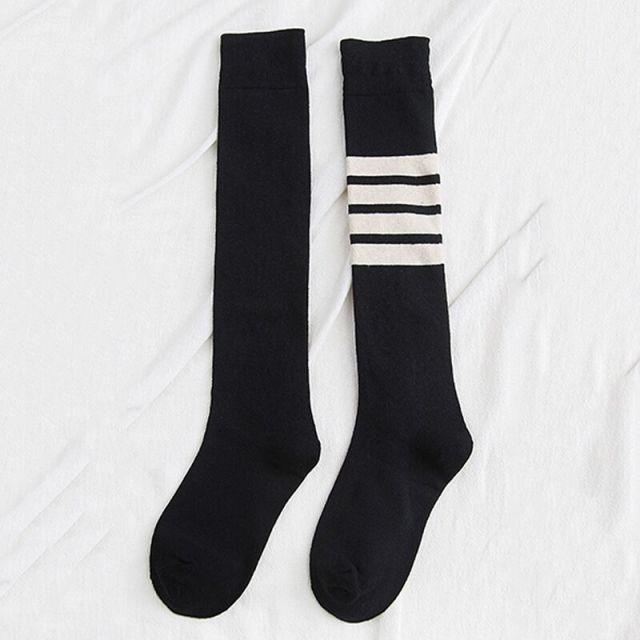 Pair of Stevvex striped thigh-high stockings, black with white top stripes, hosiery on Tampa Home & Garden Store