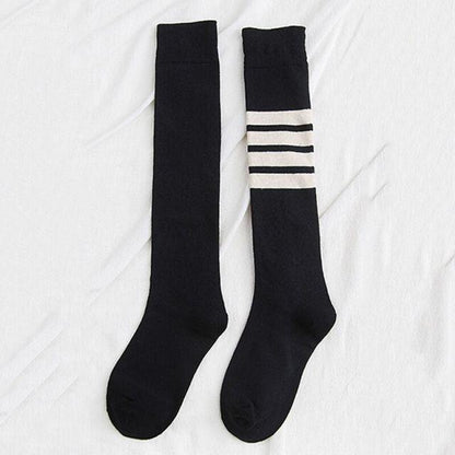 Pair of Stevvex striped thigh-high stockings, black with white top stripes, hosiery on Tampa Home & Garden Store