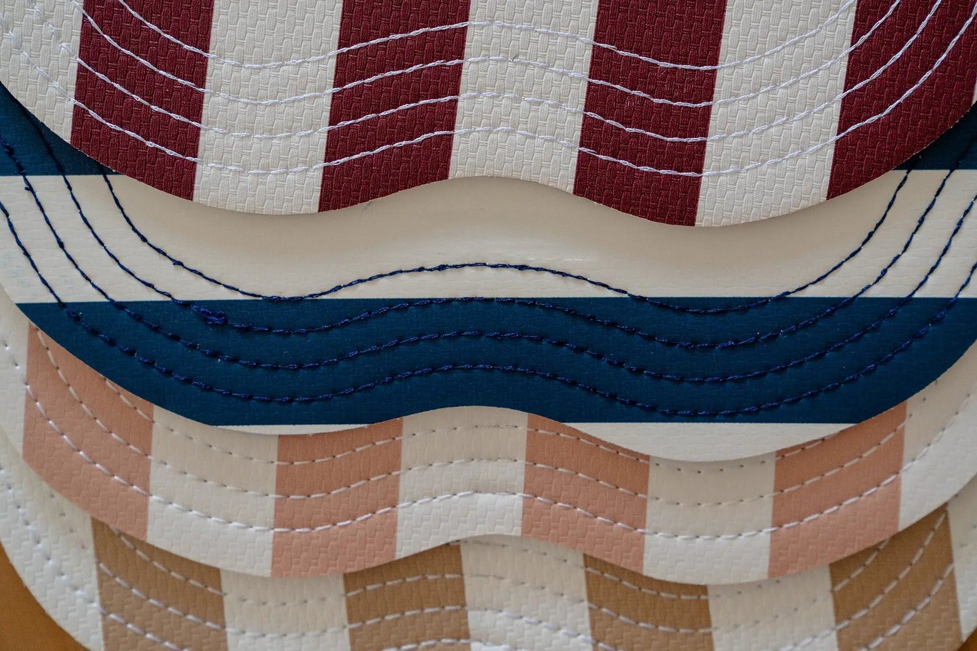 Retro pink striped placemats stacked, woven texture with vintage charm and scalloped edges on Tampa Home & Garden Store