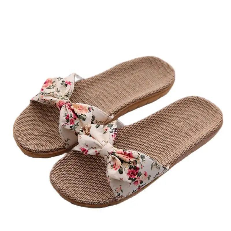 Casual women's cotton slippers pair with floral bow strap and woven footbed on Tampa Home & Garden Store
