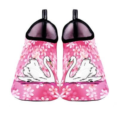 Water shoes pink pair with black trim, swan graphic and floral pattern for beach use on Tampa Home & Garden Store