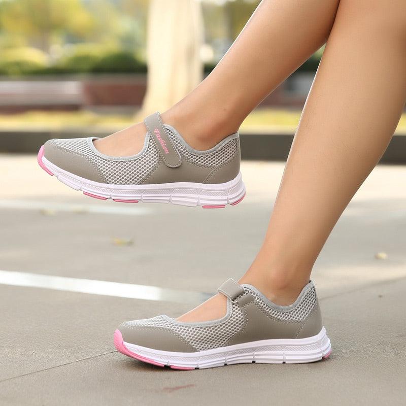 Stevvex pair of grey mesh sneakers with pink accents and Velcro strap on Tampa Home & Garden Store