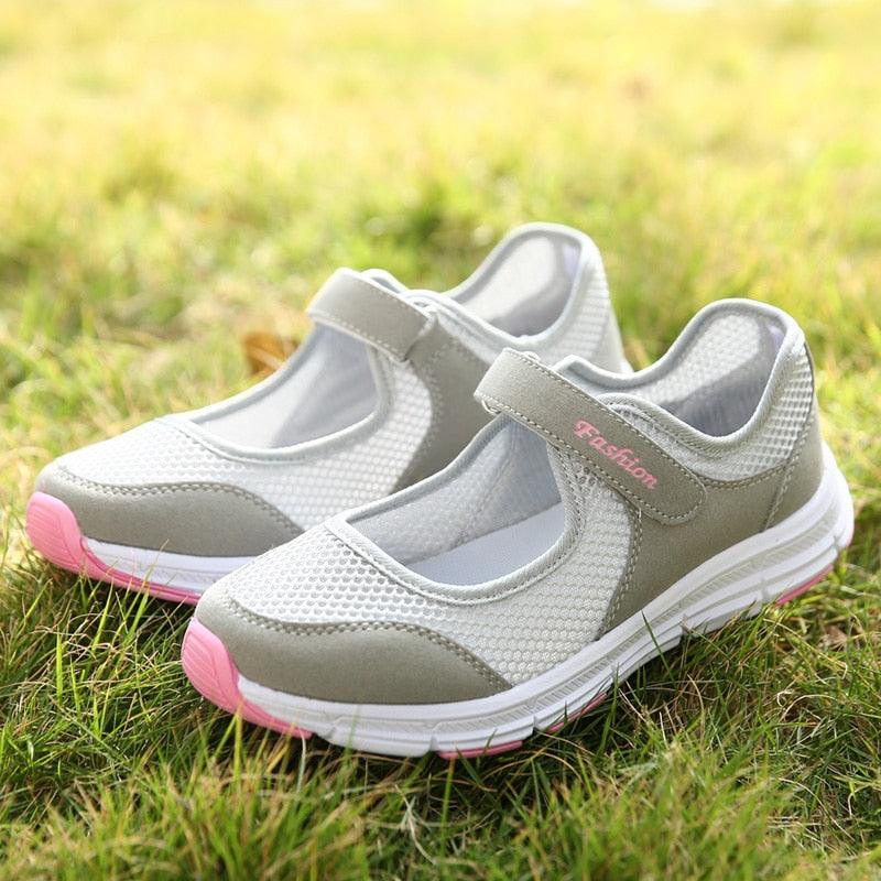 Stevvex women's breathable mesh sneakers with velcro strap, white upper and pink sole accents on Tampa Home & Garden Store