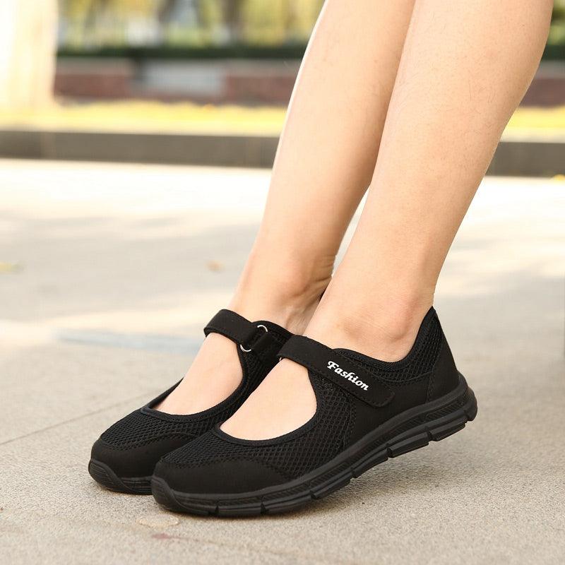 Stevvex women's breathable mesh sneakers, black with Velcro straps and grooved sole, pair on Tampa Home & Garden Store