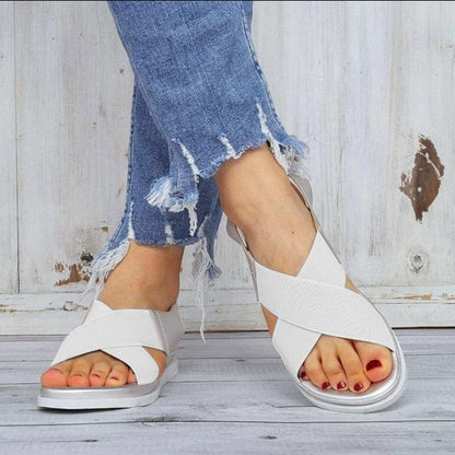 Stevvex white cross-strap slip-on sandals with elastic textile bands and a flat platform on Tampa Home & Garden Store