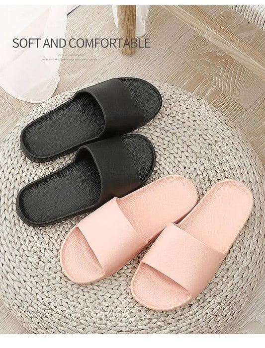 Slippers: two pairs black and blush pink slides with cushioned footbeds and non-slip soles on Tampa Home & Garden Store