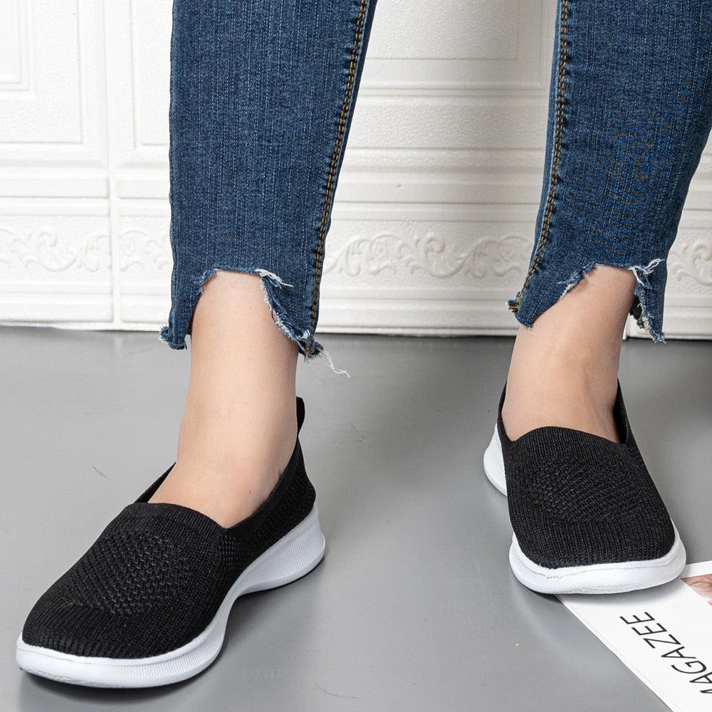 Stevvex black knit slip-on sneakers with white sole, breathable mesh upper for casual wear on Tampa Home & Garden Store