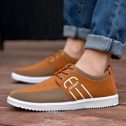 Stevvex brown canvas sneakers with white side stripes and breathable mesh panels on Tampa Home & Garden Store