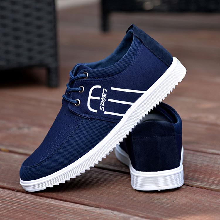 Stevvex navy blue canvas sneakers pair with white sole, lace-up, side SPORT graphic on Tampa Home & Garden Store