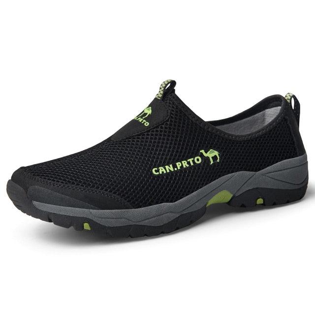 Black mesh slip-on sneakers with breathable upper and lime accents on Tampa Home & Garden Store