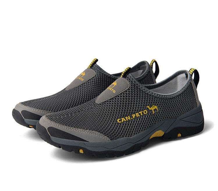 Stevvex sneakers pair, grey mesh slip-ons with yellow logo, lightweight breathable walking shoes on Tampa Home & Garden Store