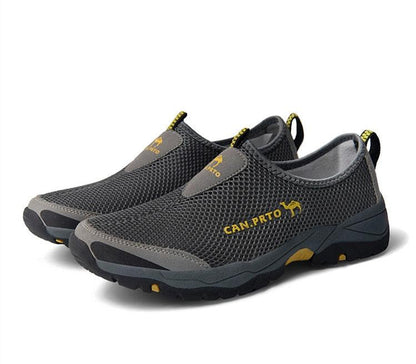 Stevvex sneakers pair, grey mesh slip-ons with yellow logo, lightweight breathable walking shoes on Tampa Home & Garden Store