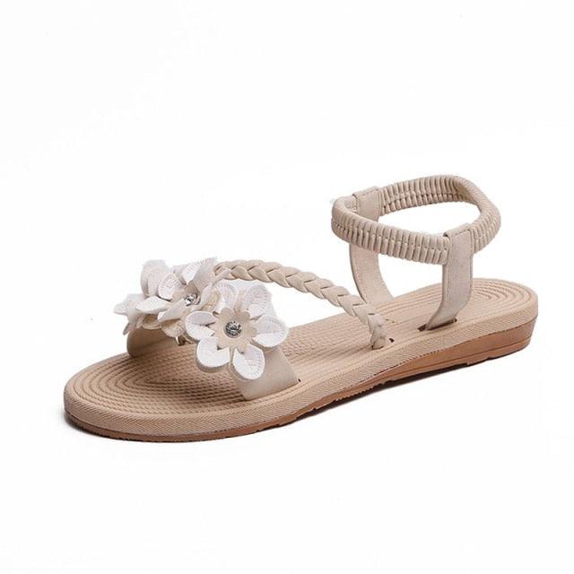 Stevvex women's flower sandal with elastic ankle strap and braided toe strap, beige flat sole on Tampa Home & Garden Store
