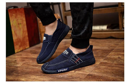 Stevvex men's navy blue canvas slip-on shoes with white stitching and sport branding on Tampa Home & Garden Store