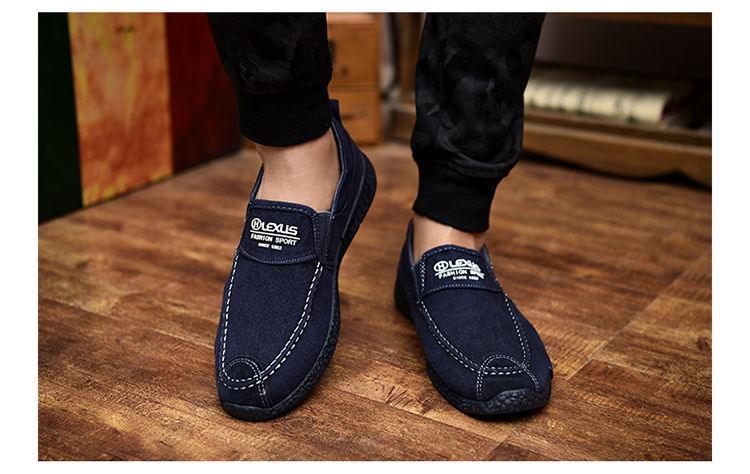 Pair of navy canvas slip-ons with white stitching and logo patch, casual shoes Stevvex on Tampa Home & Garden Store