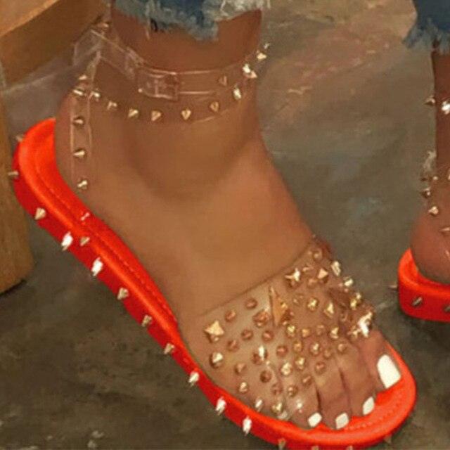 Stevvex women's sandals with transparent buckle straps, studded toe and ankle strap, red sole on Tampa Home & Garden Store