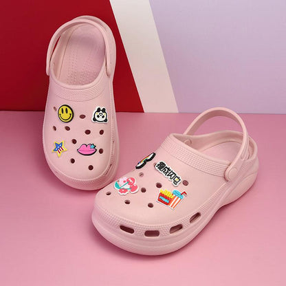 Pair of pink Stevvex garden clogs with colorful cartoon decals for outdoor wear on Tampa Home & Garden Store
