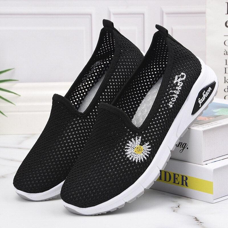 Stevvex black mesh platform sneakers, slip-on pair with daisy embroidery and white sole on Tampa Home & Garden Store
