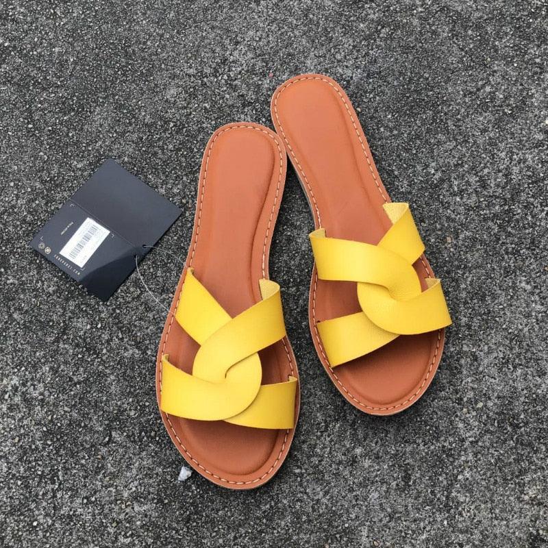 Stevvex women's yellow cross-strap sandals with yellow straps and brown stitched edge pair on Tampa Home & Garden Store