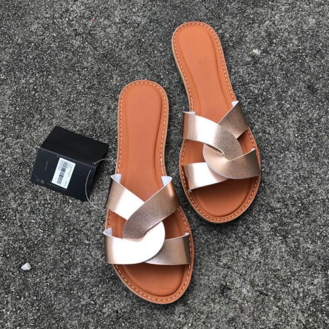 Stevvex women's cross-strap leather sandals pair with metallic rose-gold straps and tan footbed on Tampa Home & Garden Store