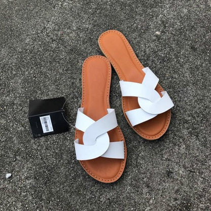pair of Stevvex white cross-strap leather sandals with tan footbed on Tampa Home & Garden Store