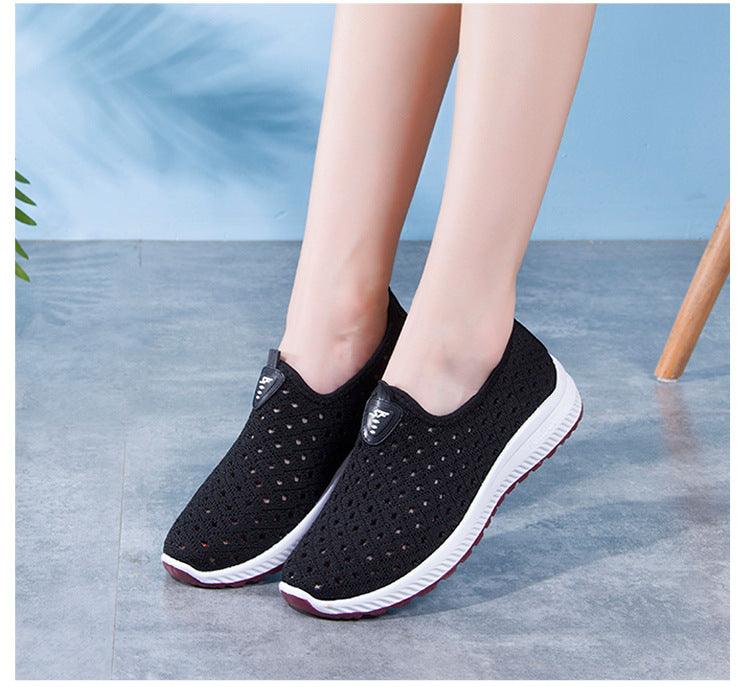 Breathable mesh slip-on sneakers by Stevvex, black knit with white sole, pink accents on Tampa Home & Garden Store