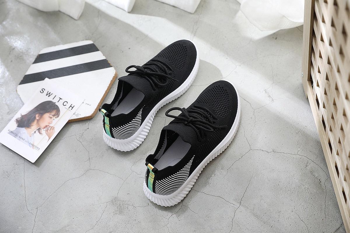 Stevvex black mesh sneakers pair with white sole and striped heel accents on Tampa Home & Garden Store