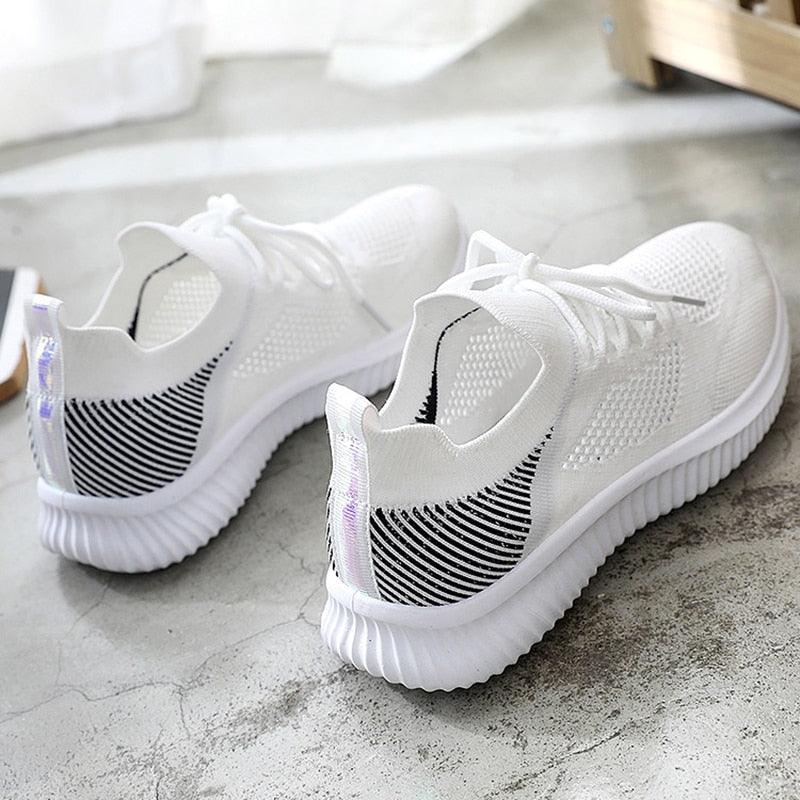 Stevvex women's white mesh sneakers with breathable knit upper and ribbed sole on Tampa Home & Garden Store