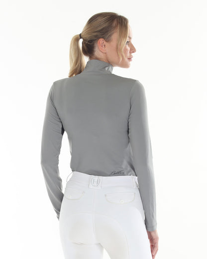 SUMMER Mini Mesh top in grey, BellEq™ riding top, back view in white breeches; BellEq logo on Tampa Home & Garden Store