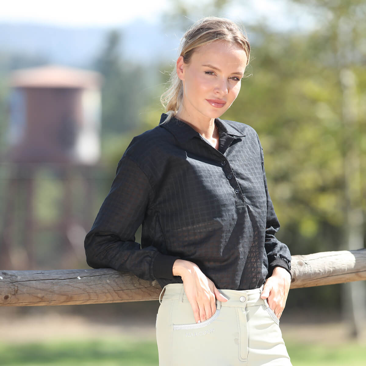SUNDAE Blackberry blouse in black sheer fabric by BellEq Equestrian Apparel worn outdoors on Tampa Home & Garden Store