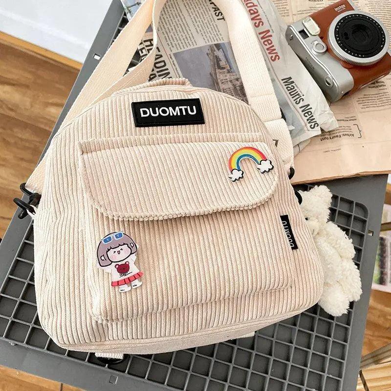 Backpack Stevvex beige corduroy mini with front pocket and patches, DUOMTU logo visible on Tampa Home & Garden Store