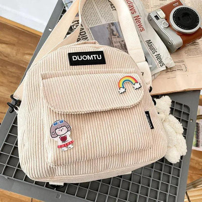 Backpack Stevvex beige corduroy mini with front pocket and patches, DUOMTU logo visible on Tampa Home & Garden Store