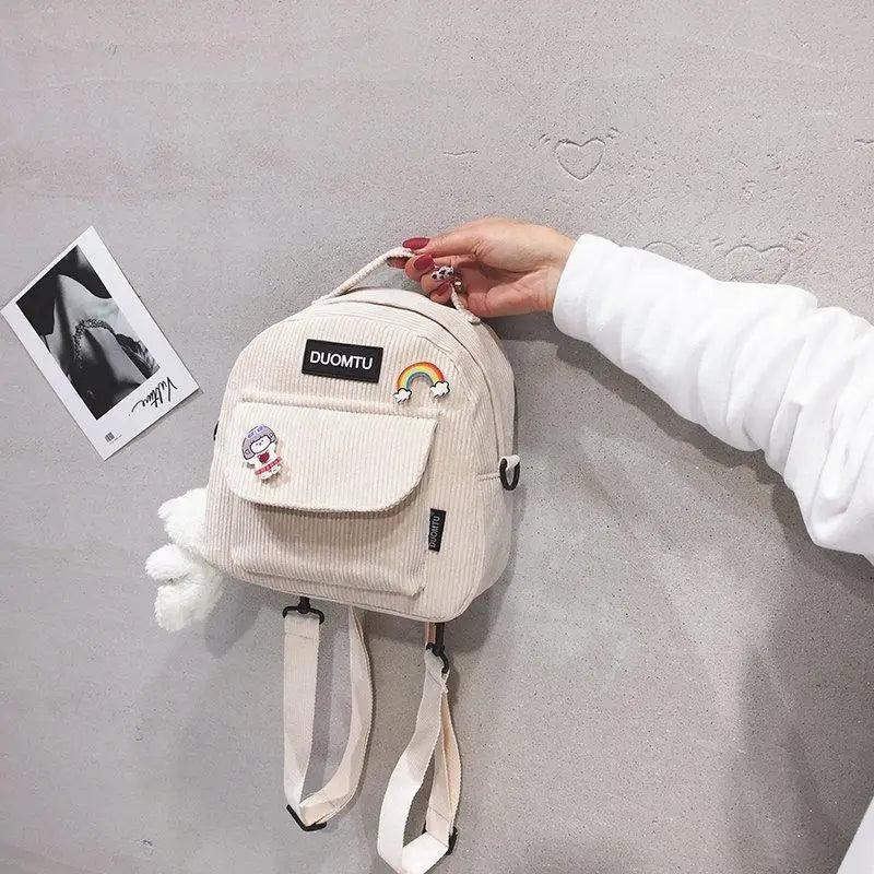 Small beige corduroy Stevvex backpack with front pocket patches and DUOMTU badge for girls on Tampa Home & Garden Store