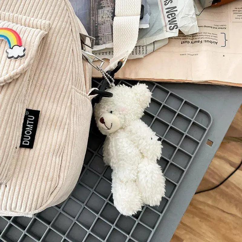 Stevvex beige corduroy mini backpack with rainbow patch and white teddy keychain on Tampa Home & Garden Store